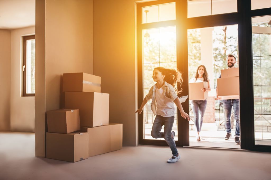 Happy family moving into a new house