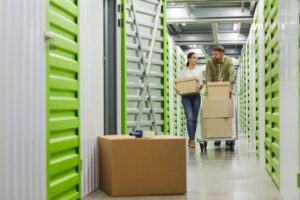 Couple packing a storage unit