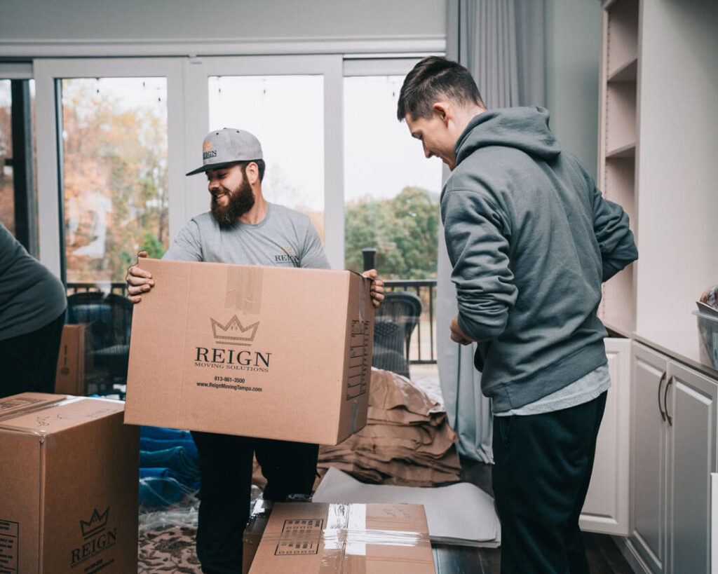 Two men organizing items before a move