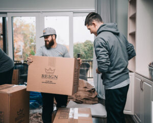 Two men organizing items before a move